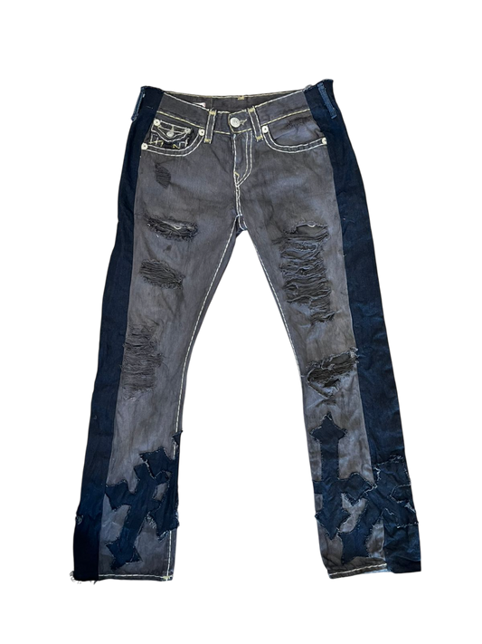 Triple black jeans with crosses